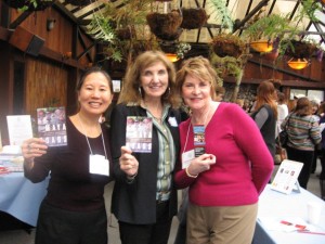 Teresa LeYung Ryan & Judith Marshall  cheer for Mary Jo McConahay (middle)